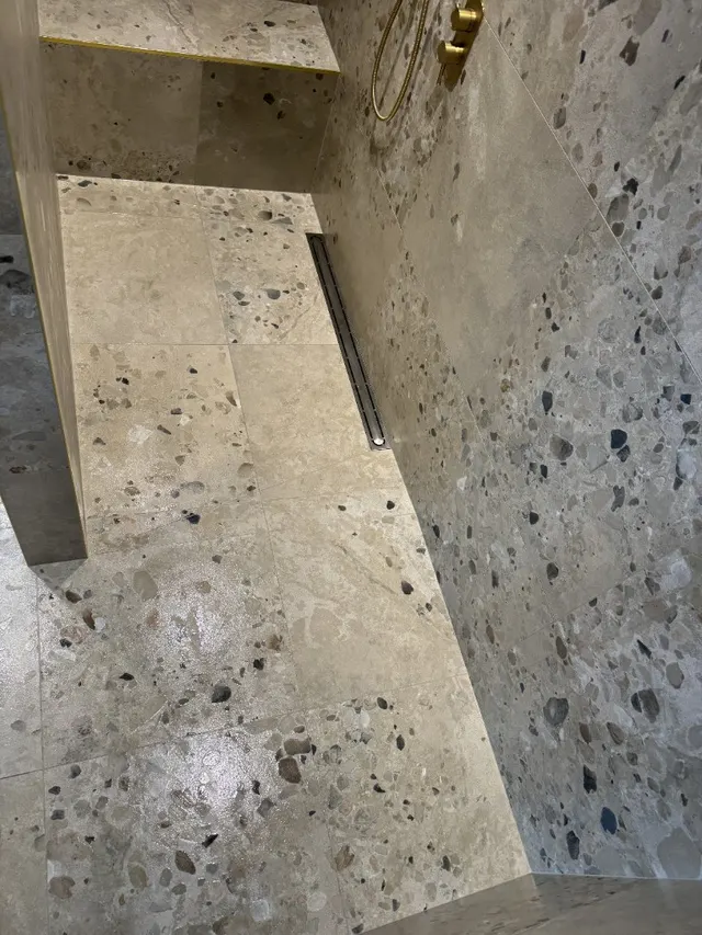 Surface Renaud – terrazzo shower floor with linear drain detail